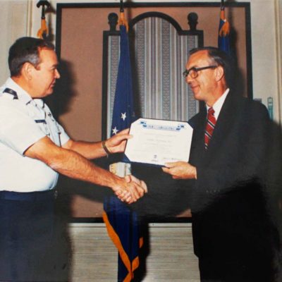 Sechan receiving an award.